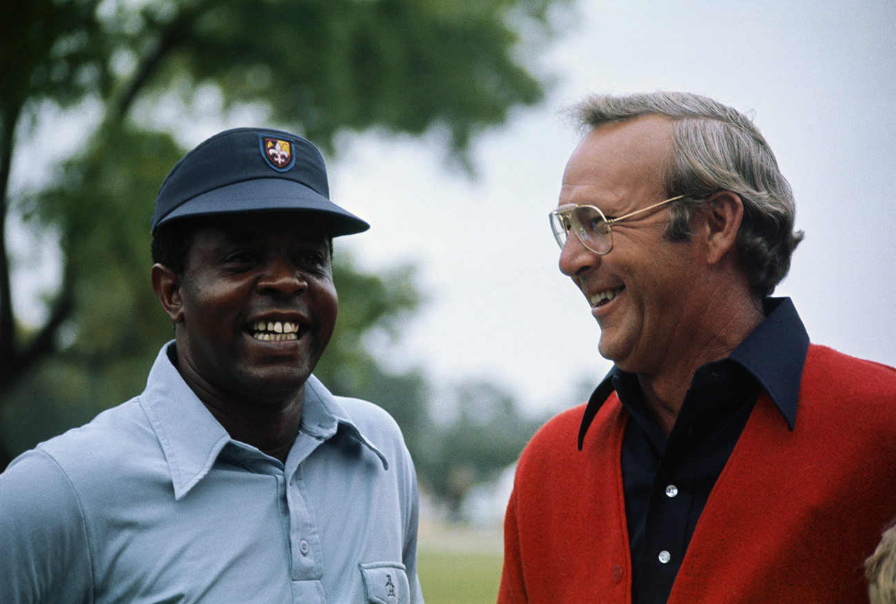 (Original Caption) New York, N.Y.: Lee Elder (L) and Arnold Palmer share a laugh during a recent tournament. Elder will be the first black to ever compete in the Masters Golf tourney. Lee elder gained his berth as the first black ever to compete in the Masters Golf Tournament by winning the Monastic Open, April 21, 1974.
